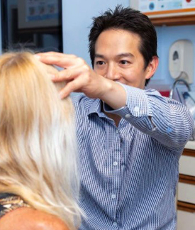 Dr Lee Examines the Forehead of Patient