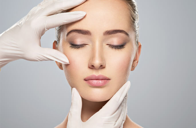 Stock image of female model doctor checking face