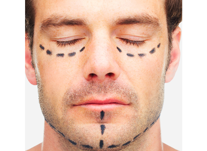 Stock Image of Male Model Face with Sketch Marks Below Eyes and Chin