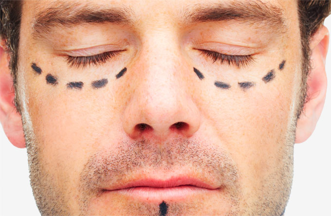 Stock Image of Male Model Face with Sketch Marks Below Eyes and Chin